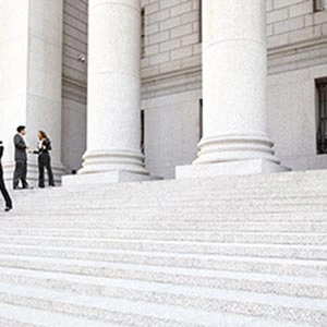 lawyers standing on courtroom steps trial litigation