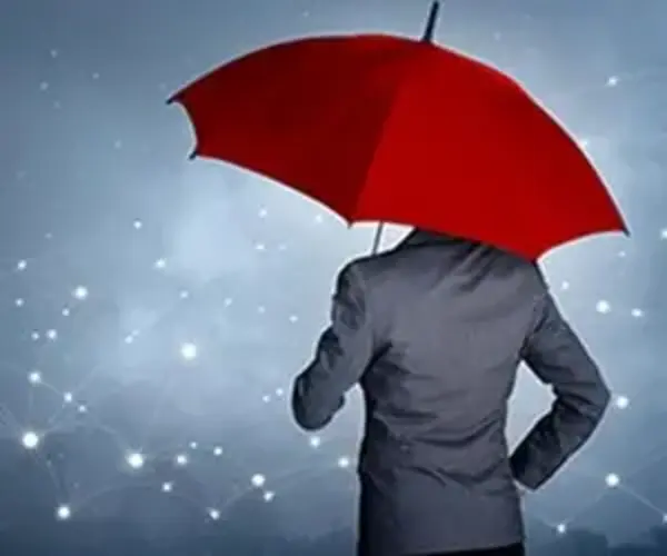 man with umbrella in city insurance crisis coverage