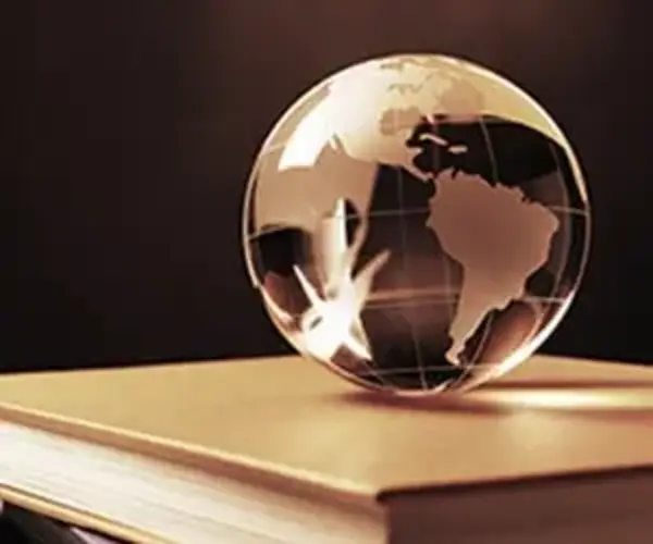 globe of the world on a stack of books
