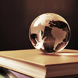 globe of the world on a stack of books