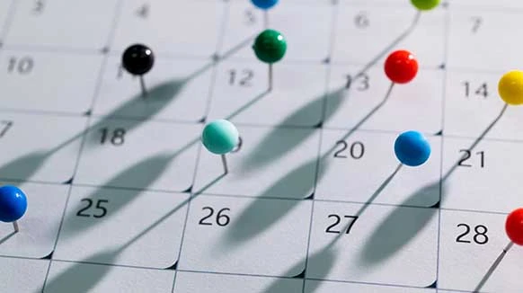colored pins on calendar