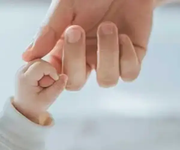 holding hands baby and parent family