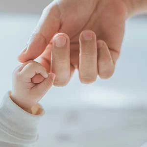 holding hands baby and parent family